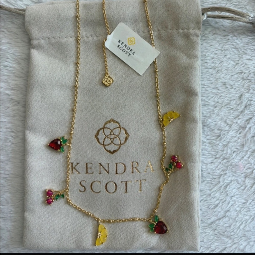 Brand new Kendra Scott Gold Necklace w. Jeweled fruits.